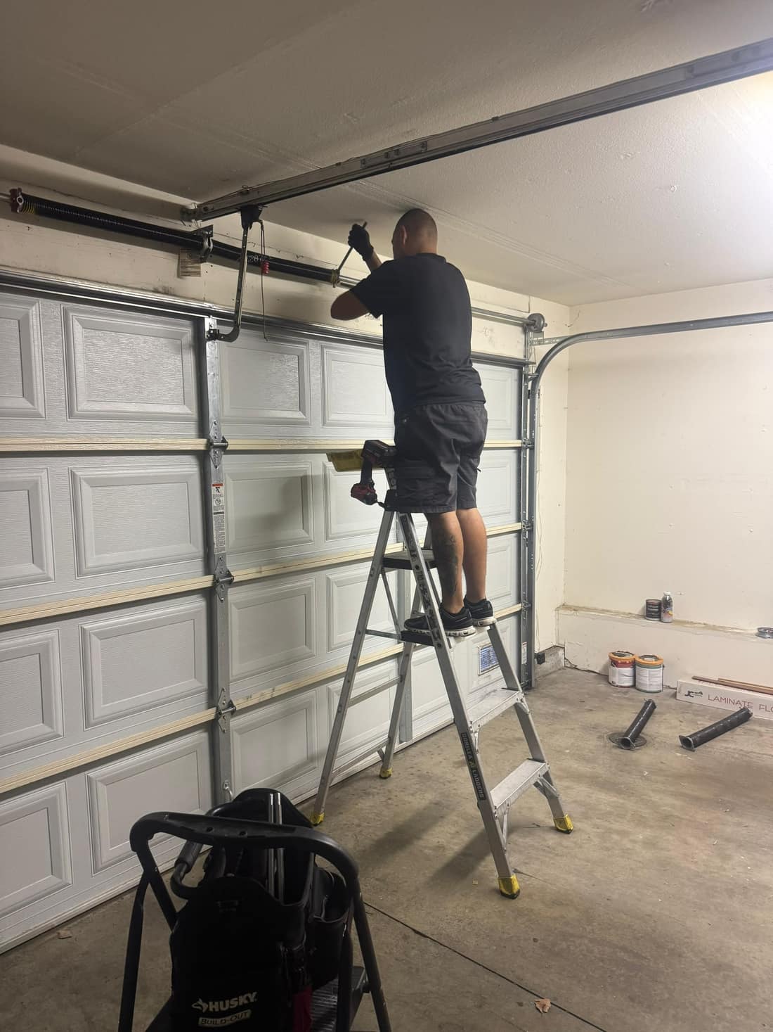 Torsion spring replacement in progress