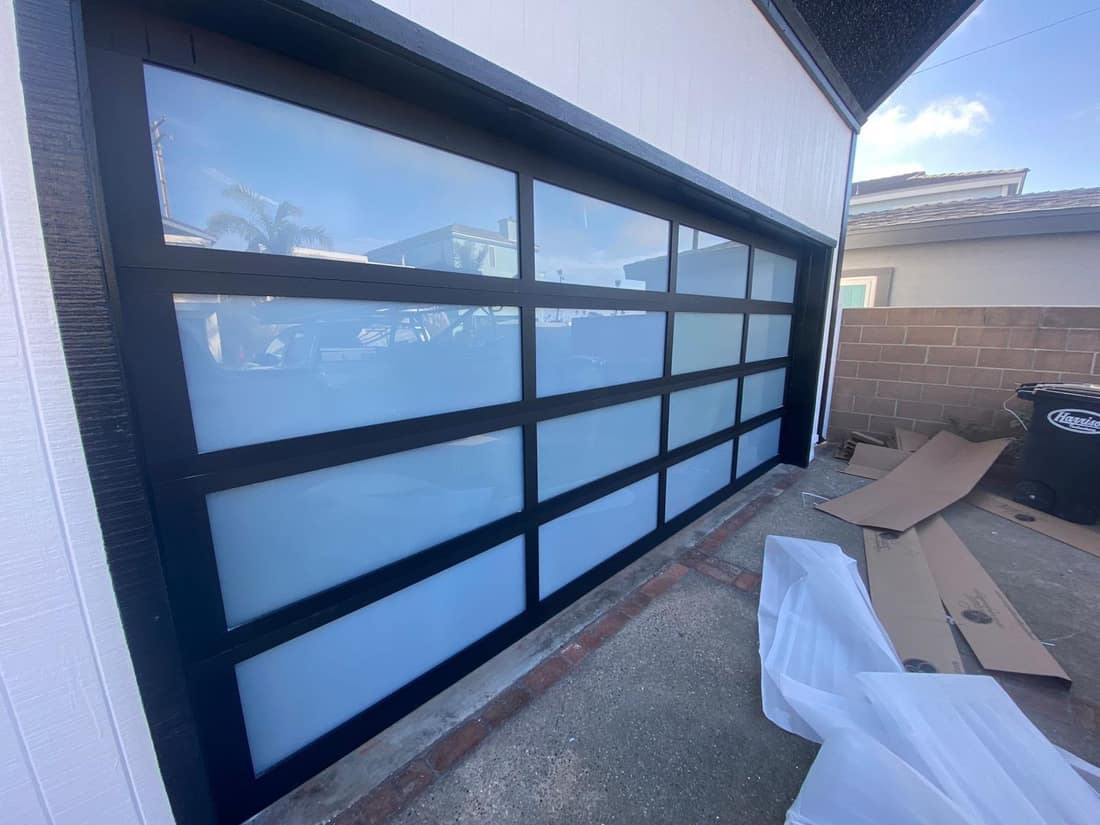 Black framed full-view glass garage door