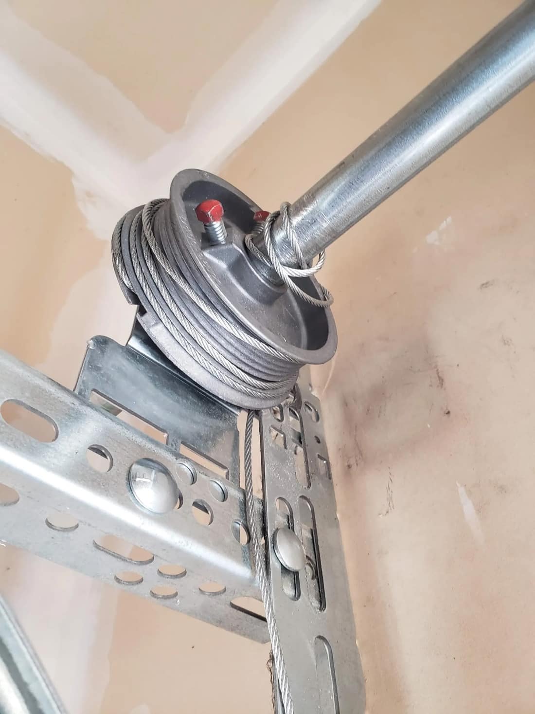Garage door cable and drum repair close-up